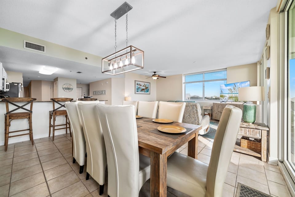 From casual meals to formal gatherings, this versatile space offers a comfortable dining area and a relaxed living space with direct balcony access.