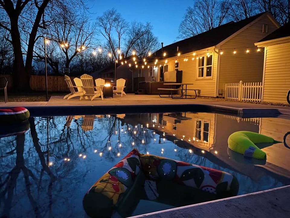 Enjoy the ultimate relaxation with poolside vibes, a soothing hot tub, and a cozy fire pit. Whether you're playing backyard games, grilling your favorite meal, or just lounging under the twinkling lights, this space is your perfect escape for a wonde