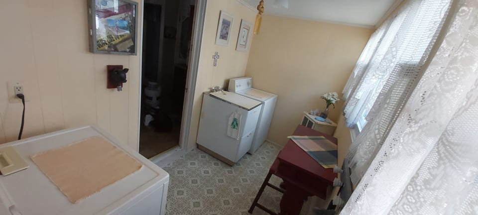 1st floor Laundry Room: washer, dryer, iron, folding table