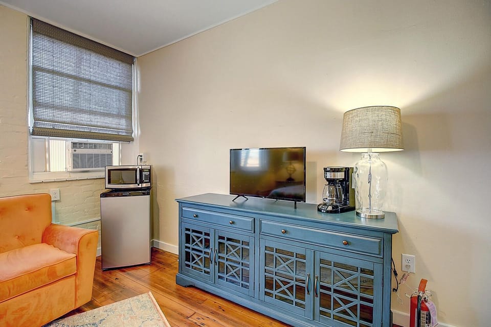 Settle into your cozy entertainment corner with a flat-screen TV, mini-fridge, and coffee maker for those perfect morning brews.