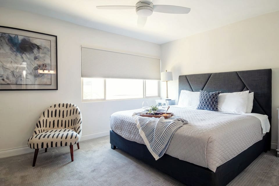 King bedroom with blackout shades for a restful night's sleep.