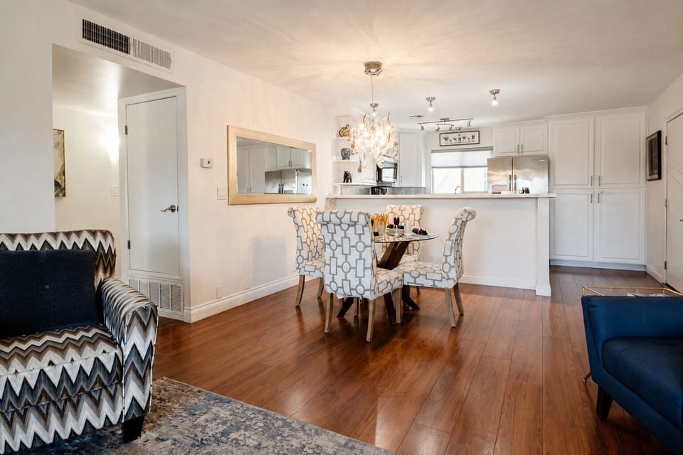 Dining for four opens to the fully equipped kitchen for easy meals.
