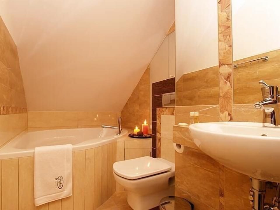Spring water tub, designer toiletries, hair dryer (on request), slippers