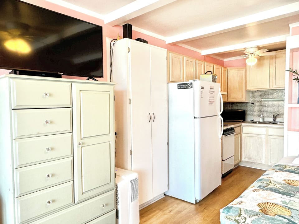 Refrigerator/mini kitchen.