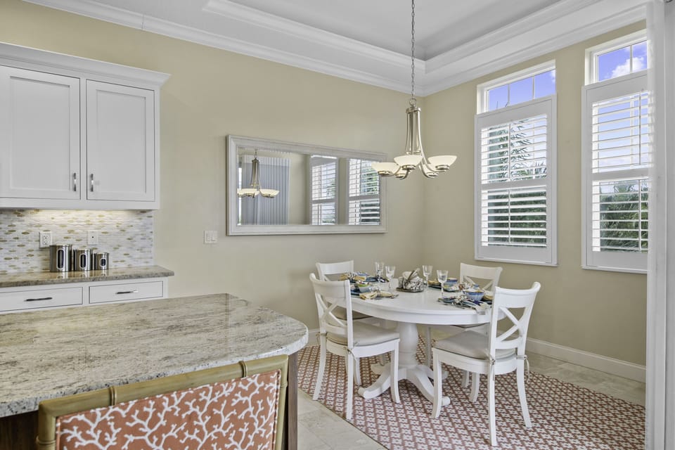 A quaint breakfast nook seamlessly flows from the kitchen.