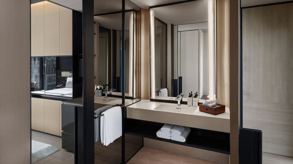 Designer toiletries, hair dryer, bathrobes, slippers