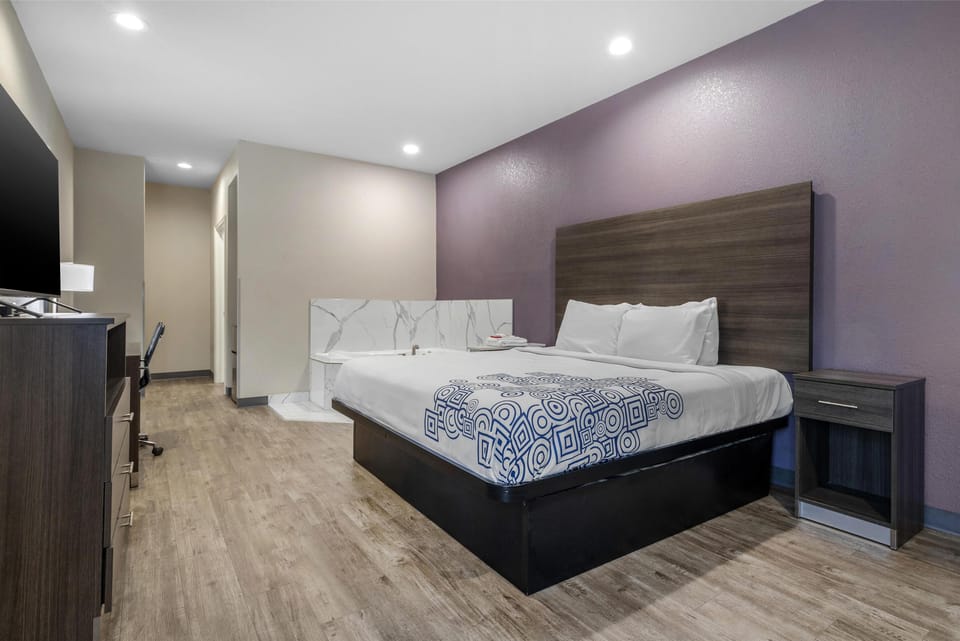 Suite, 1 King Bed, Non Smoking, Jetted Tub | Desk, laptop workspace, blackout drapes, soundproofing