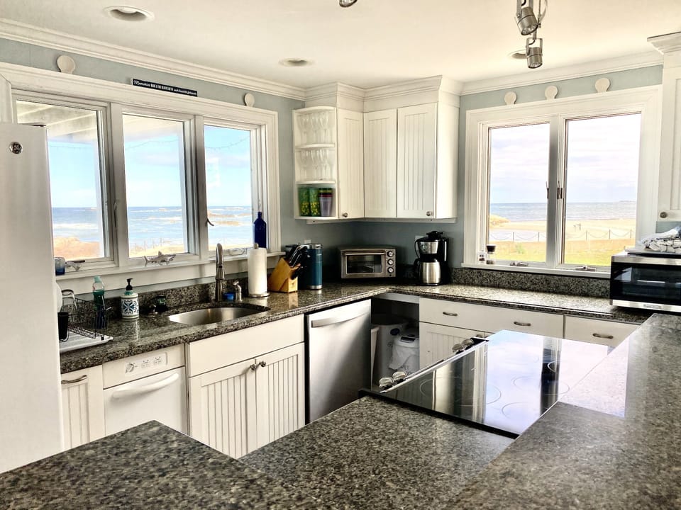 Well equipped kitchen with microwave, toaster, toaster oven, coffee maker, etc