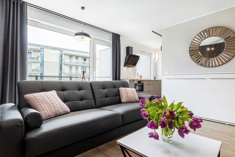 The cozy living area featuring a comfy sofa perfect for relaxing after a day of exploring the city.