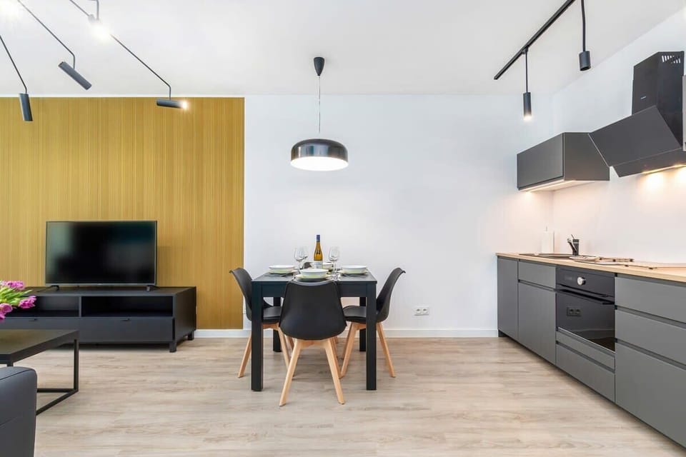 Kitchenette with oven and refrigerator. 