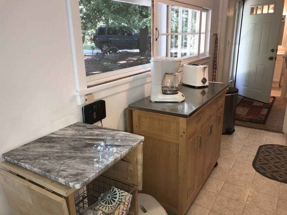 Small but well-equipped galley kitchen with full size appliances/coffee maker 