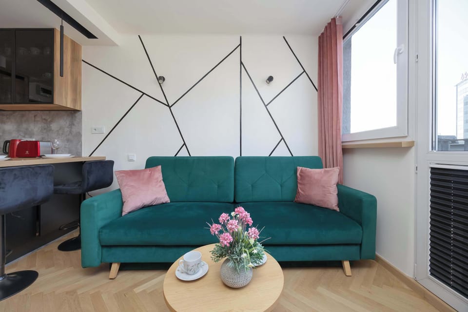 Cozy seating area with sofa and coffee table.