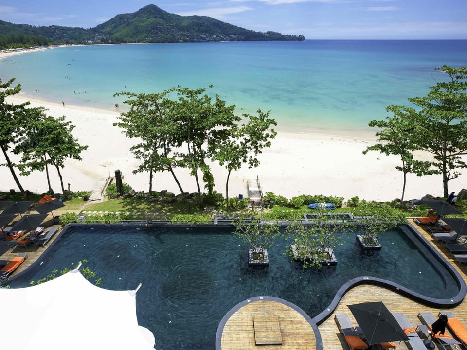 Outdoor pool, open 7:00 AM to 7:00 PM, sun loungers