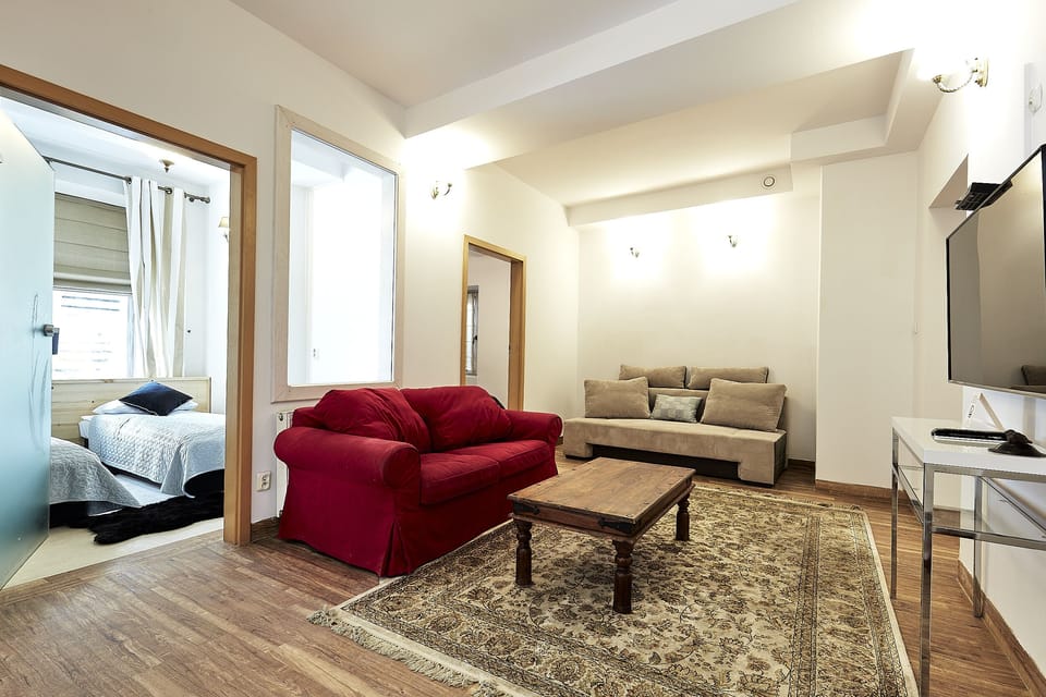 Comfort Apartment | Living room | 42-inch LCD TV with satellite channels, TV