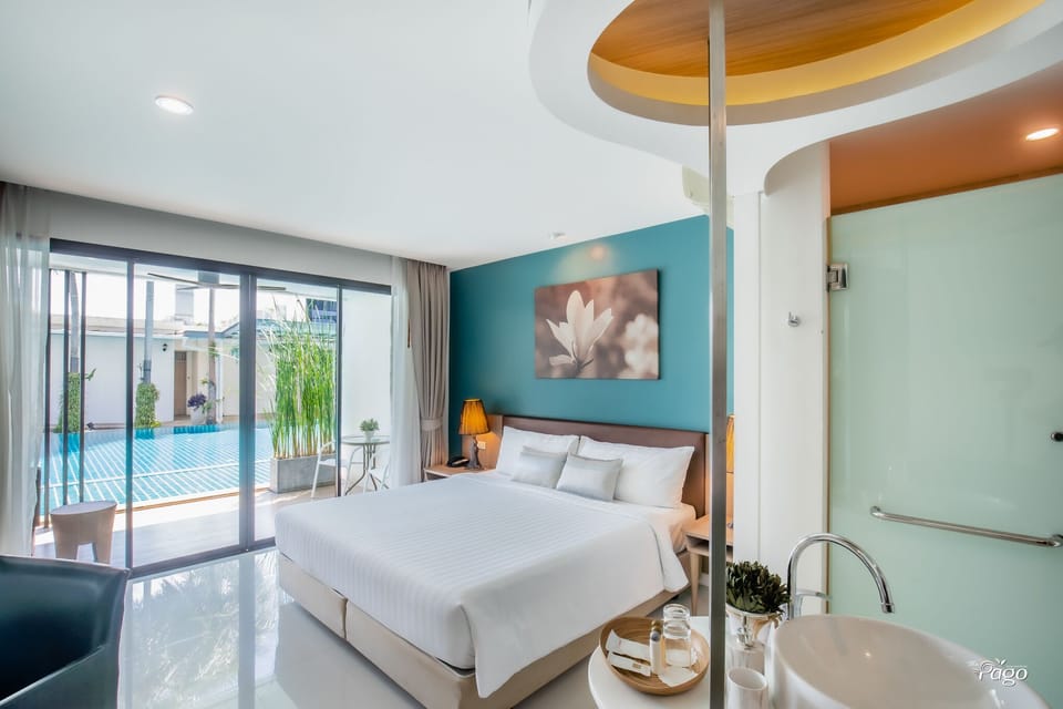 Deluxe Room, Pool Access | In-room safe, individually decorated, desk, blackout drapes