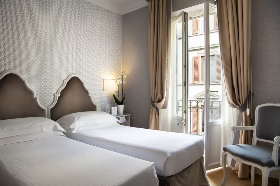 Premium bedding, down comforters, free minibar items, in-room safe