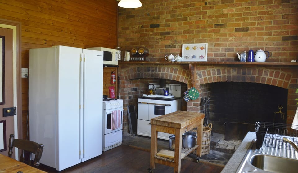 Kitchen with open fireplace