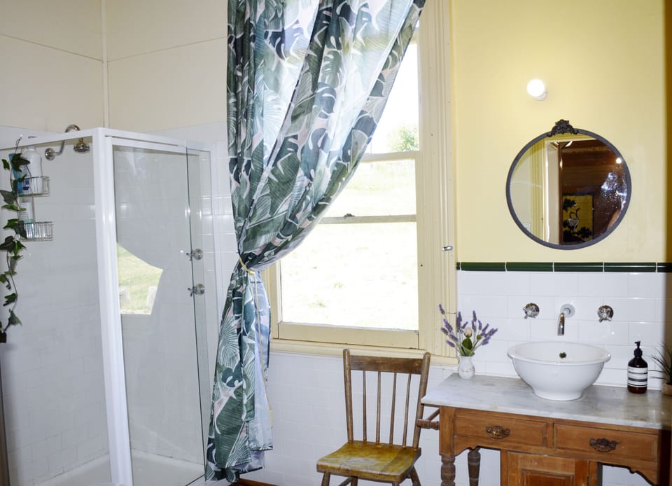 Bathroom with shower and claw foot bath and separate toilet