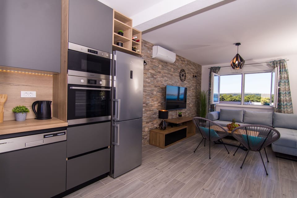Apartment (A1) | Private kitchen | Fridge, microwave, stovetop, dishwasher
