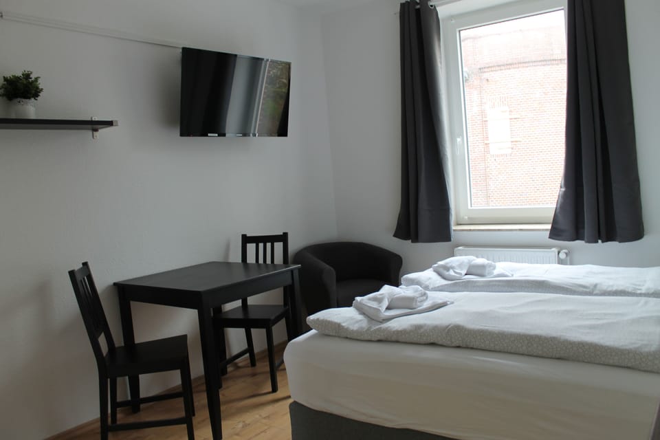 Double Room | Living area | 32-inch flat-screen TV with satellite channels, TV
