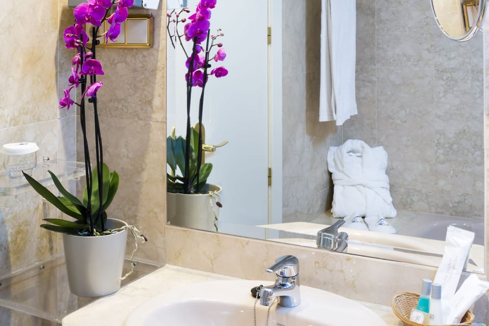 Deep soaking tub, eco-friendly toiletries, hair dryer, towels