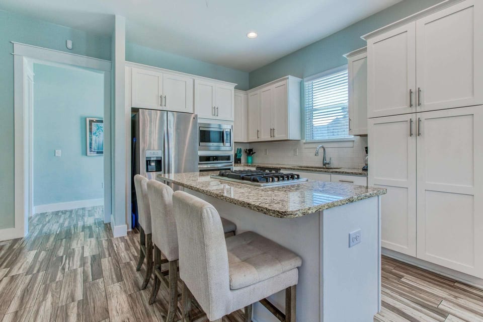 Fully stocked kitchen offers beautiful granite countertops with all stainless appliances