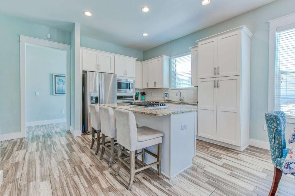 Fully stocked kitchen offers beautiful granite countertops with all stainless appliances