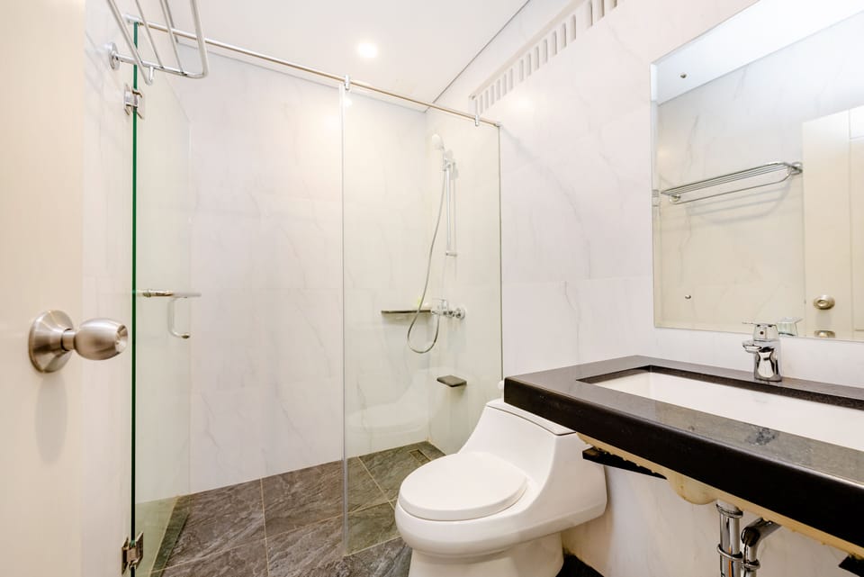 Shower, free toiletries, slippers, towels