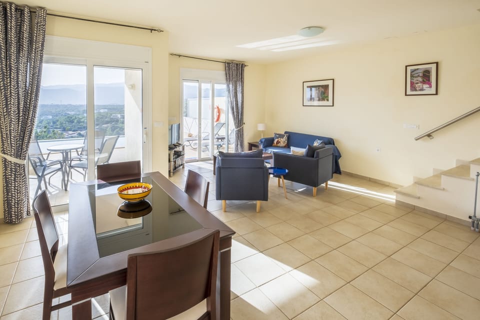 The dining and living room area with the terrace