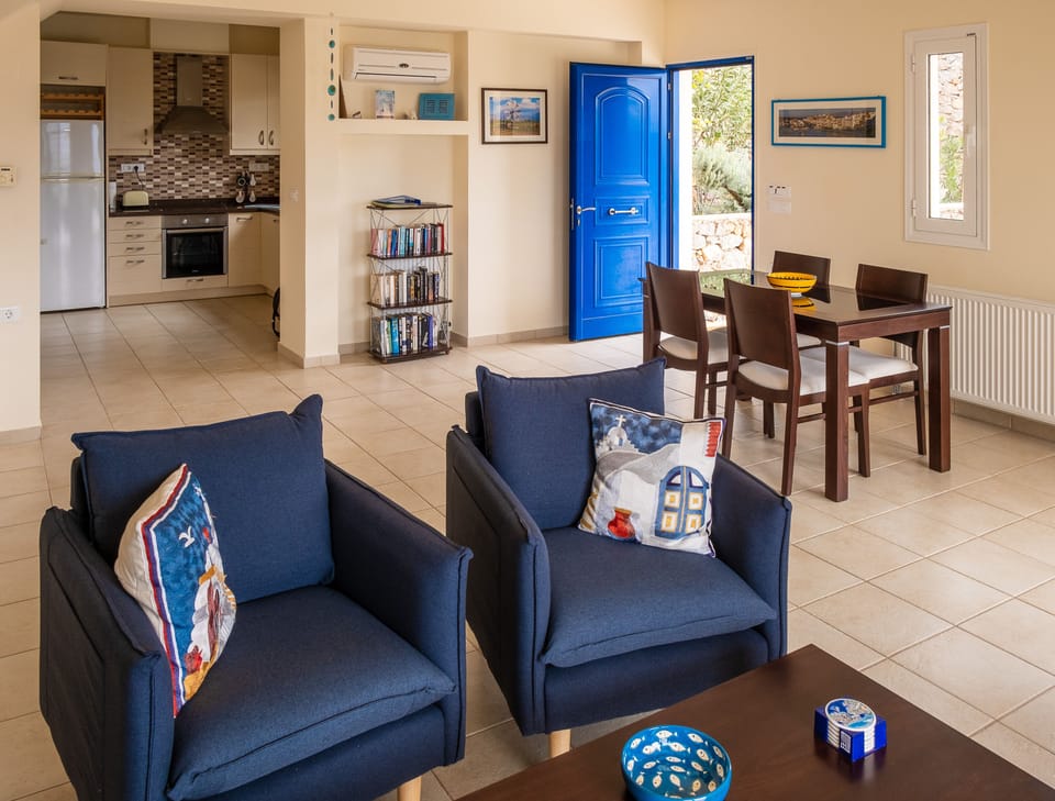 Open plan living room with new sofa and armchairs added in March 2022