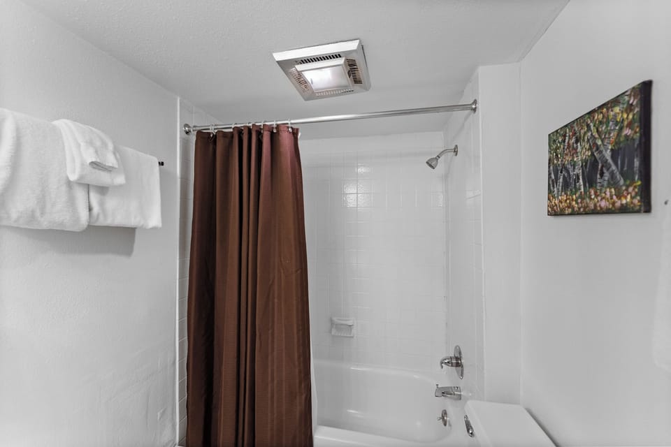 Refresh in your spacious bathroom with a deep soaking tub, rainfall shower, and fresh towels waiting for you.