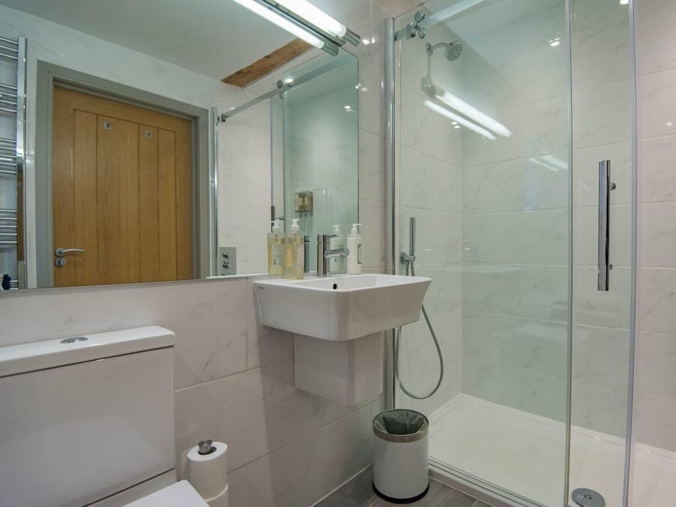 bathroom with bath as well as walk in shower