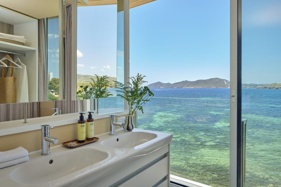 Designer toiletries, hair dryer, bathrobes, slippers