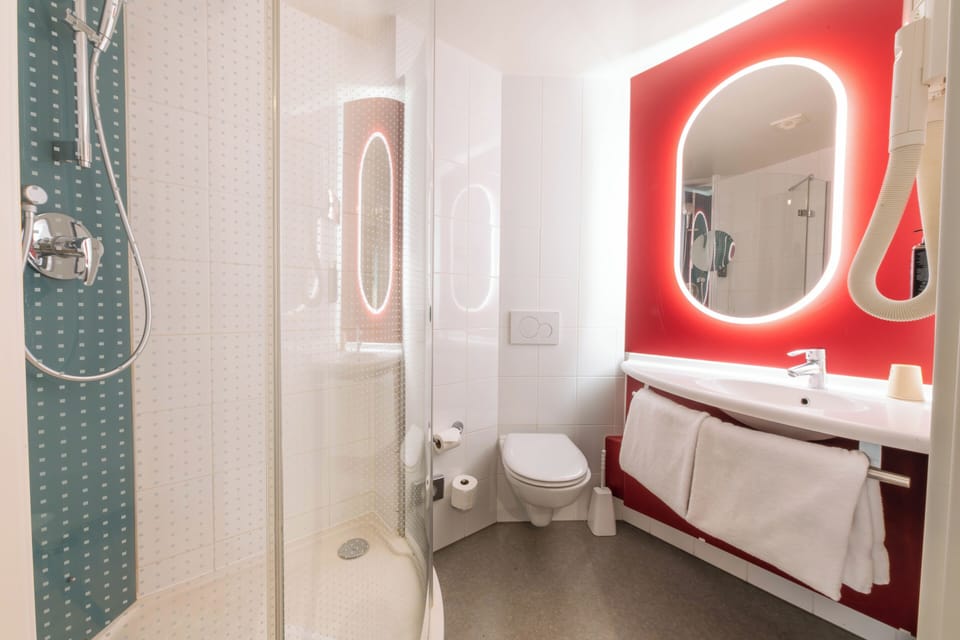 Shower, eco-friendly toiletries, hair dryer, towels