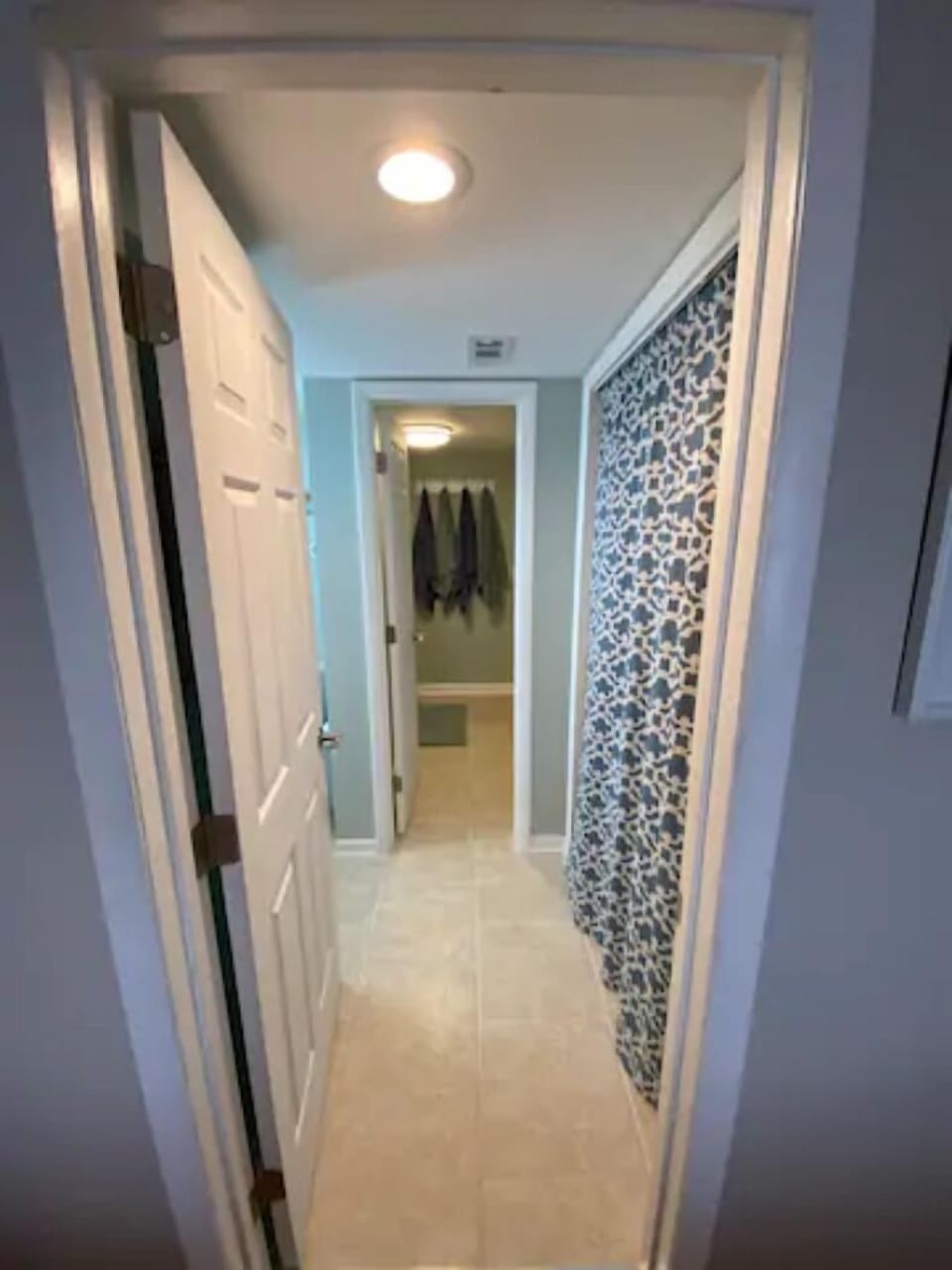 View from master to half bath and closet with laundry