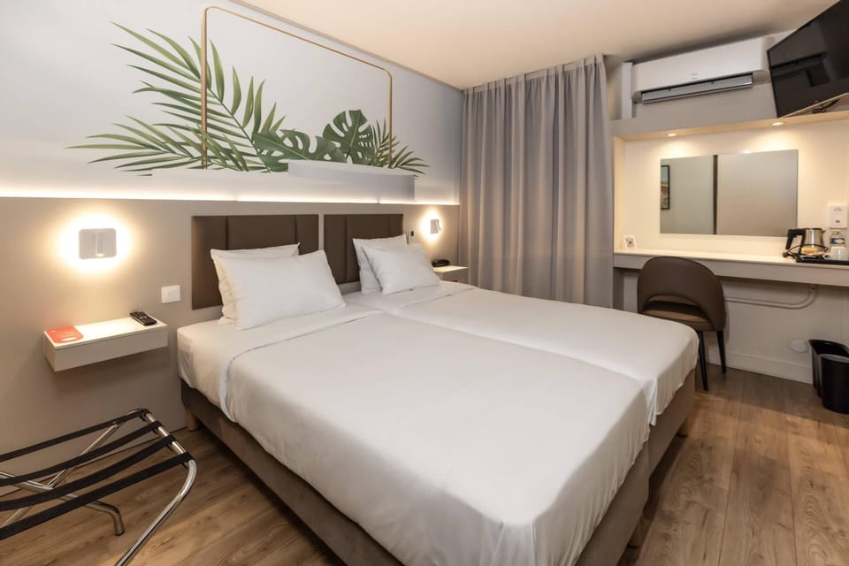 Twin Room | Premium bedding, desk, soundproofing, free cribs/infant beds