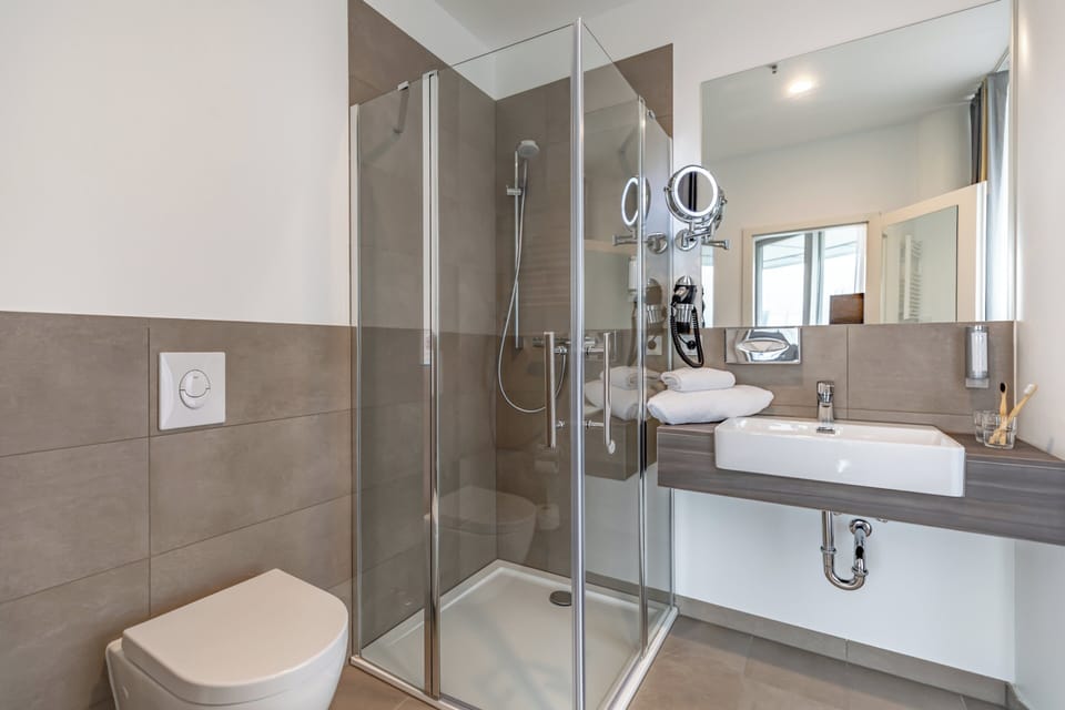 Rainfall showerhead, hair dryer, towels