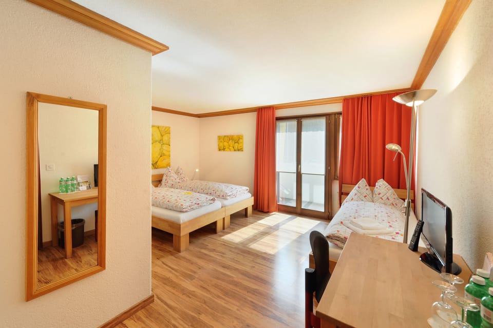 Triple Room | Desk, blackout drapes, bed sheets, alarm clocks