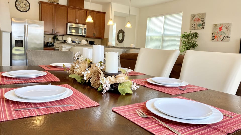 Dine in style at the chic dining area, elegantly decorated for six.