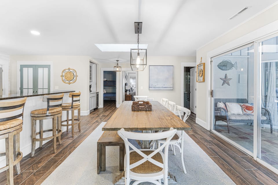 Dining area just off kitchen with sliders out to the pool