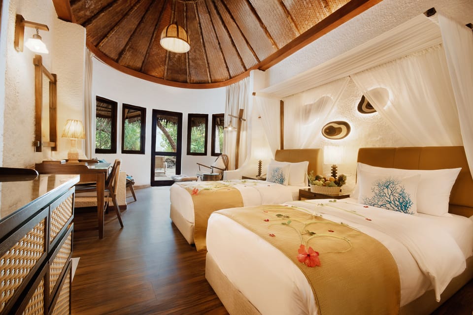 Deluxe Beach Bungalow | Minibar, in-room safe, desk, blackout drapes