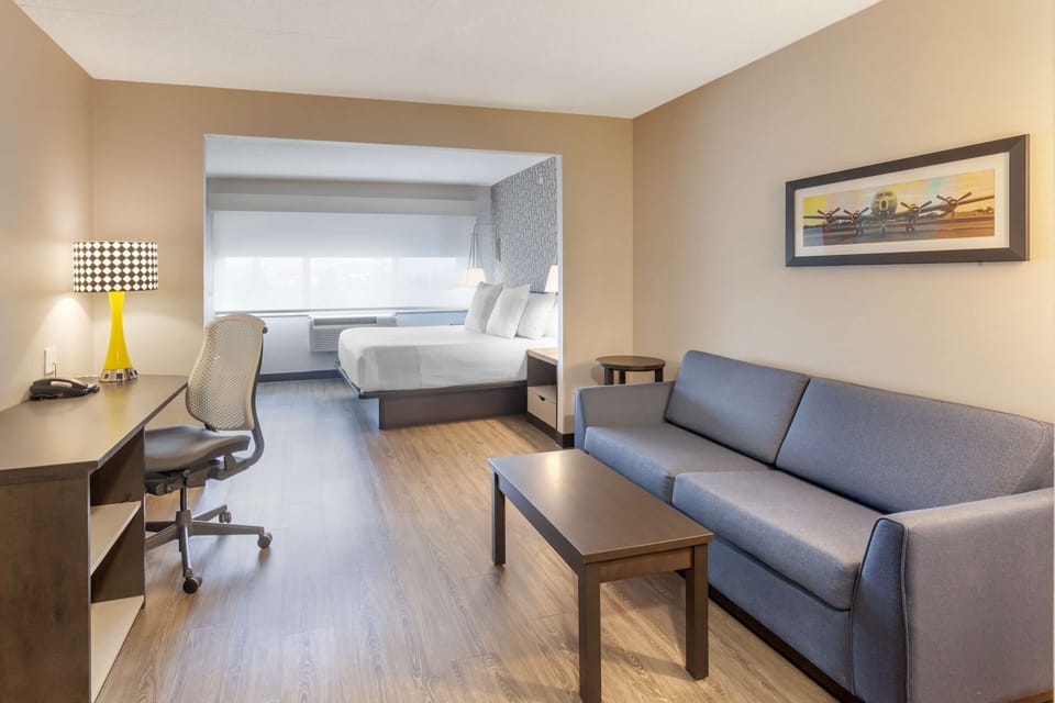 Suite, 1 King Bed, Non Smoking, Kitchenette (Walk-in Shower;with Sofabed) | Living area | 50-inch TV with cable channels, Netflix, streaming services