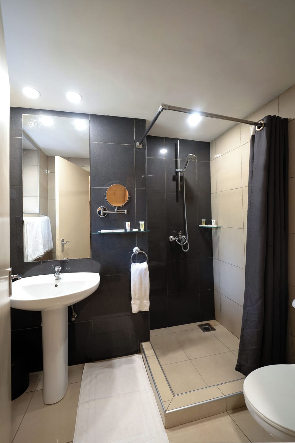 Shower, rainfall showerhead, designer toiletries, hair dryer