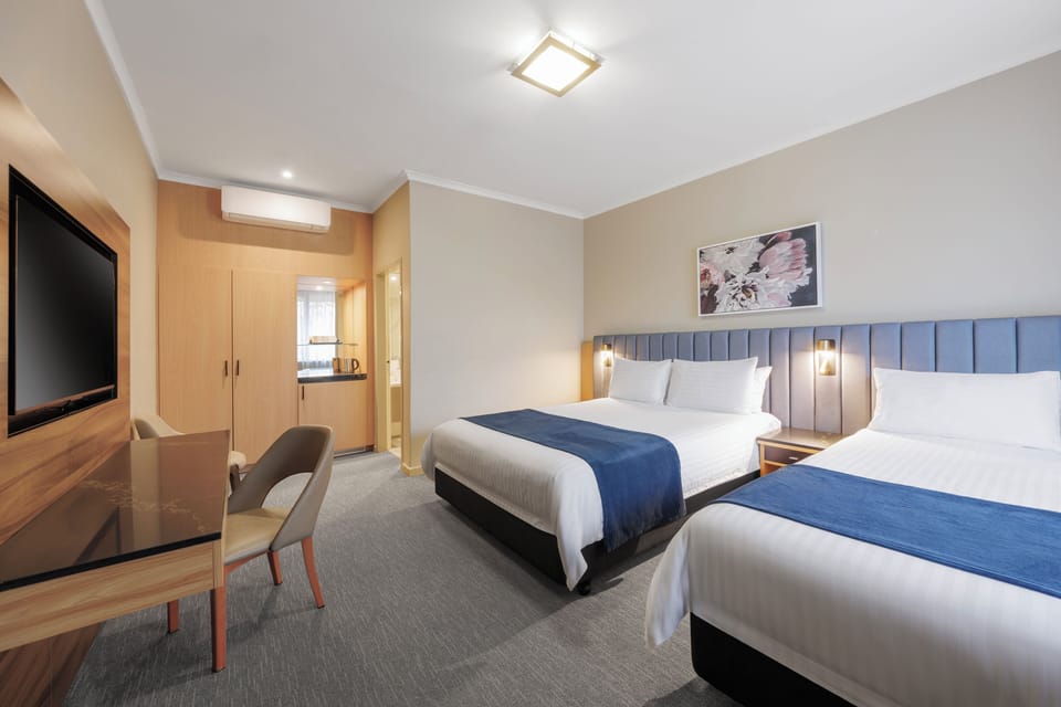Deluxe Room, Multiple Beds, Non Smoking (Walk-in Shower) | Premium bedding, in-room safe, desk, laptop workspace