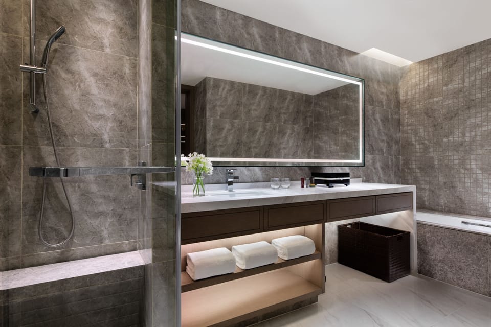 Apartment, 1 Bedroom | Bathroom | Separate tub and shower, rainfall showerhead, free toiletries