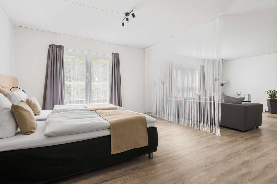 Family Room, Multiple Beds, Non Smoking (Separate Living Room) | Desk, laptop workspace, blackout drapes, iron/ironing board