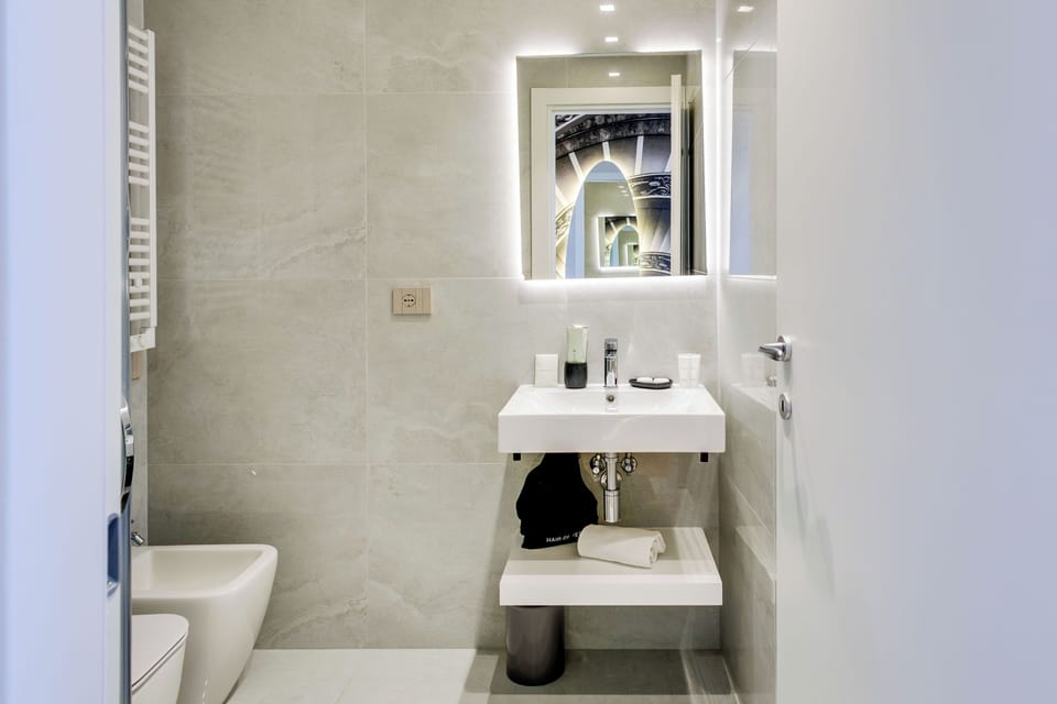 Deluxe City View with Terrace | Bathroom | Shower, rainfall showerhead, designer toiletries, hair dryer