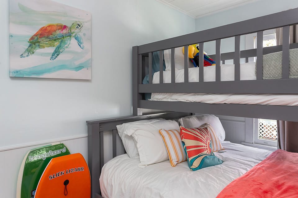 Bunk room has a queen bed with twin bunk atop, and a tiwn trundle bed that slides out as needed.  This room sleeps up to 4. Big TV with premium cable and awesome sound system.