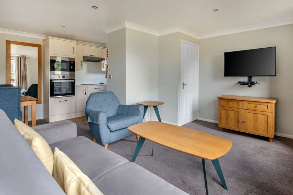 Spacious and modern living area with ample seating for guests and family.