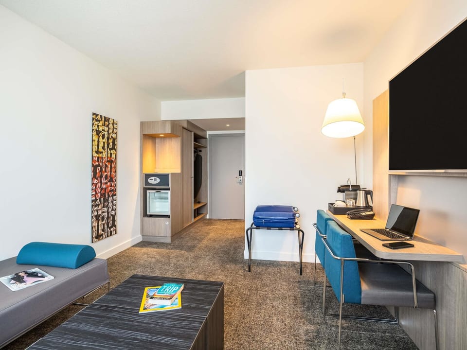 Hypo-allergenic bedding, free minibar items, in-room safe, desk